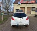 Белый Мазда 2, объемом двигателя 1.4 л и пробегом 100 тыс. км за 4800 $, фото 1 на Automoto.ua
