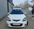 Белый Мазда 2, объемом двигателя 1.4 л и пробегом 121 тыс. км за 5500 $, фото 1 на Automoto.ua