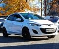 Білий Мазда 2, об'ємом двигуна 1.5 л та пробігом 106 тис. км за 8499 $, фото 1 на Automoto.ua