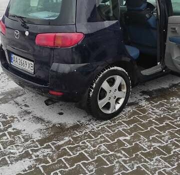Чорний Мазда 2, об'ємом двигуна 1.4 л та пробігом 262 тис. км за 4485 $, фото 1 на Automoto.ua