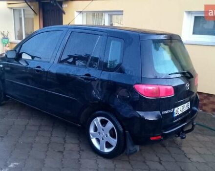 Черный Мазда 2, объемом двигателя 1.4 л и пробегом 237 тыс. км за 4300 $, фото 1 на Automoto.ua