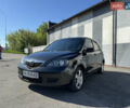 Черный Мазда 2, объемом двигателя 1.4 л и пробегом 235 тыс. км за 4300 $, фото 1 на Automoto.ua
