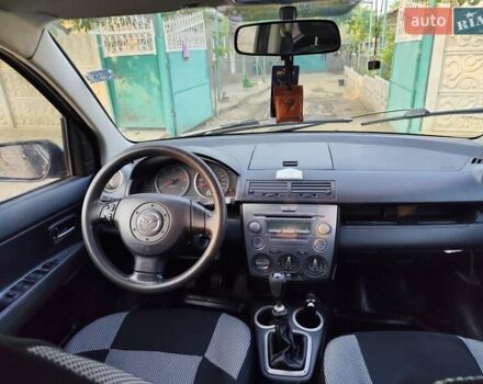 Чорний Мазда 2, об'ємом двигуна 1.4 л та пробігом 205 тис. км за 3700 $, фото 11 на Automoto.ua