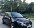 Черный Мазда 2, объемом двигателя 1.4 л и пробегом 237 тыс. км за 3750 $, фото 1 на Automoto.ua