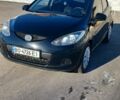Черный Мазда 2, объемом двигателя 1.3 л и пробегом 260 тыс. км за 4450 $, фото 1 на Automoto.ua