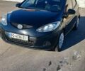 Черный Мазда 2, объемом двигателя 1.35 л и пробегом 260 тыс. км за 4450 $, фото 1 на Automoto.ua
