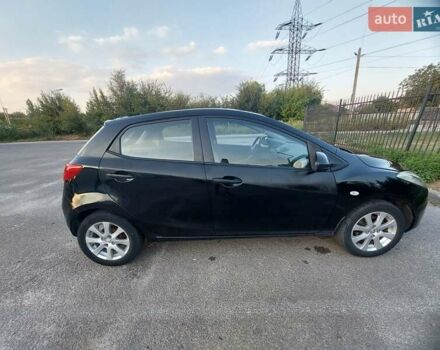 Черный Мазда 2, объемом двигателя 1.35 л и пробегом 187 тыс. км за 4800 $, фото 1 на Automoto.ua