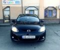 Черный Мазда 2, объемом двигателя 1.5 л и пробегом 158 тыс. км за 4950 $, фото 1 на Automoto.ua