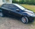 Черный Мазда 2, объемом двигателя 1.3 л и пробегом 261 тыс. км за 3900 $, фото 1 на Automoto.ua