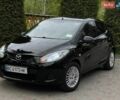 Черный Мазда 2, объемом двигателя 1.4 л и пробегом 190 тыс. км за 3750 $, фото 1 на Automoto.ua