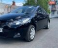 Черный Мазда 2, объемом двигателя 1.5 л и пробегом 185 тыс. км за 4799 $, фото 1 на Automoto.ua