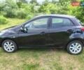 Чорний Мазда 2, об'ємом двигуна 1.35 л та пробігом 338 тис. км за 4000 $, фото 1 на Automoto.ua