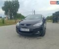 Черный Мазда 2, объемом двигателя 1.4 л и пробегом 195 тыс. км за 4900 $, фото 1 на Automoto.ua