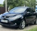 Черный Мазда 2, объемом двигателя 1.4 л и пробегом 233 тыс. км за 3599 $, фото 1 на Automoto.ua