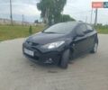 Черный Мазда 2, объемом двигателя 1.4 л и пробегом 195 тыс. км за 4700 $, фото 1 на Automoto.ua