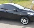 Чорний Мазда 2, об'ємом двигуна 1.5 л та пробігом 86 тис. км за 7750 $, фото 1 на Automoto.ua