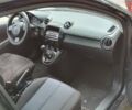 Черный Мазда 2, объемом двигателя 1.3 л и пробегом 117 тыс. км за 5500 $, фото 1 на Automoto.ua