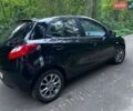 Черный Мазда 2, объемом двигателя 1.35 л и пробегом 191 тыс. км за 6000 $, фото 1 на Automoto.ua