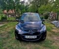 Черный Мазда 2, объемом двигателя 1.5 л и пробегом 185 тыс. км за 7200 $, фото 1 на Automoto.ua
