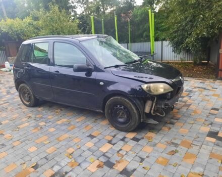 Черный Мазда 2, объемом двигателя 1.2 л и пробегом 200 тыс. км за 1300 $, фото 1 на Automoto.ua