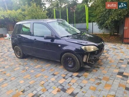 Черный Мазда 2, объемом двигателя 1.24 л и пробегом 200 тыс. км за 1200 $, фото 1 на Automoto.ua