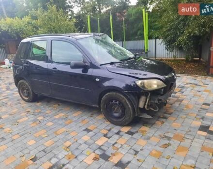 Черный Мазда 2, объемом двигателя 1.24 л и пробегом 200 тыс. км за 1200 $, фото 1 на Automoto.ua