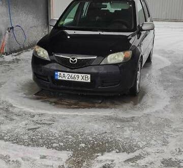 Чорний Мазда 2, об'ємом двигуна 1.4 л та пробігом 262 тис. км за 4485 $, фото 1 на Automoto.ua