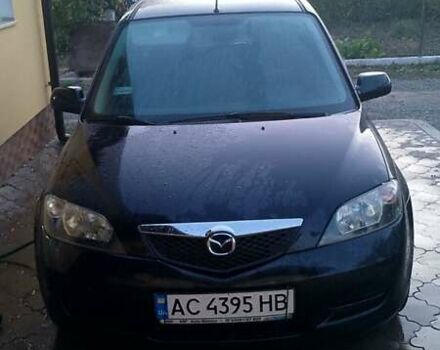 Черный Мазда 2, объемом двигателя 1.4 л и пробегом 237 тыс. км за 4300 $, фото 1 на Automoto.ua