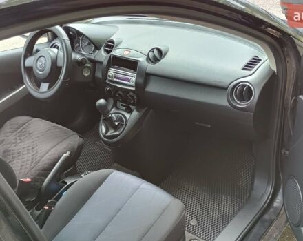 Чорний Мазда 2, об'ємом двигуна 1.3 л та пробігом 117 тис. км за 5500 $, фото 1 на Automoto.ua