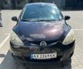 Коричневый Мазда 2, объемом двигателя 1.5 л и пробегом 141 тыс. км за 6600 $, фото 1 на Automoto.ua