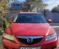 Красный Мазда 2, объемом двигателя 2 л и пробегом 265 тыс. км за 3650 $, фото 1 на Automoto.ua