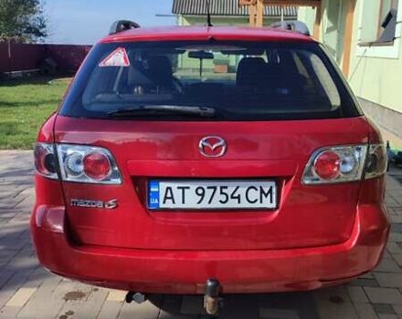 Красный Мазда 2, объемом двигателя 2 л и пробегом 265 тыс. км за 3650 $, фото 4 на Automoto.ua