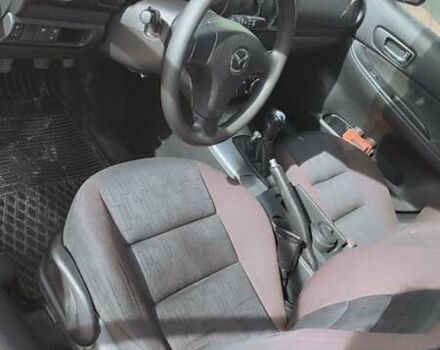 Красный Мазда 2, объемом двигателя 2 л и пробегом 265 тыс. км за 3650 $, фото 2 на Automoto.ua