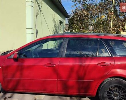 Красный Мазда 2, объемом двигателя 2 л и пробегом 265 тыс. км за 3650 $, фото 1 на Automoto.ua