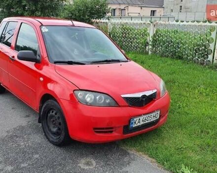 Червоний Мазда 2, об'ємом двигуна 1.2 л та пробігом 329 тис. км за 1850 $, фото 1 на Automoto.ua