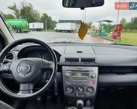 Червоний Мазда 2, об'ємом двигуна 1.4 л та пробігом 170 тис. км за 4200 $, фото 1 на Automoto.ua