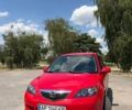 Червоний Мазда 2, об'ємом двигуна 1.4 л та пробігом 299 тис. км за 3600 $, фото 1 на Automoto.ua