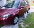 Красный Мазда 2, объемом двигателя 1.4 л и пробегом 305 тыс. км за 3600 $, фото 1 на Automoto.ua