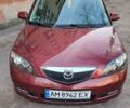 Красный Мазда 2, объемом двигателя 1.4 л и пробегом 131 тыс. км за 4900 $, фото 2 на Automoto.ua