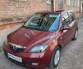 Красный Мазда 2, объемом двигателя 1.4 л и пробегом 131 тыс. км за 4900 $, фото 1 на Automoto.ua