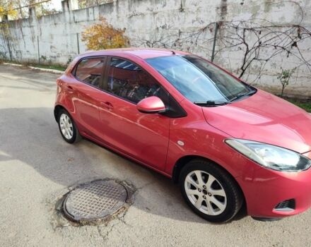 Красный Мазда 2, объемом двигателя 1.5 л и пробегом 138 тыс. км за 6500 $, фото 1 на Automoto.ua