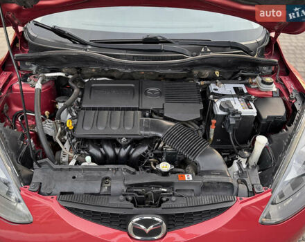 Червоний Мазда 2, об'ємом двигуна 1.5 л та пробігом 138 тис. км за 6800 $, фото 48 на Automoto.ua