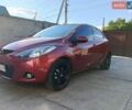 Красный Мазда 2, объемом двигателя 1.5 л и пробегом 160 тыс. км за 6200 $, фото 1 на Automoto.ua