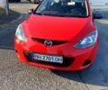 Красный Мазда 2, объемом двигателя 1.4 л и пробегом 232 тыс. км за 3900 $, фото 1 на Automoto.ua