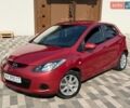 Красный Мазда 2, объемом двигателя 1.5 л и пробегом 124 тыс. км за 5850 $, фото 1 на Automoto.ua