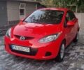 Червоний Мазда 2, об'ємом двигуна 1.4 л та пробігом 198 тис. км за 5300 $, фото 1 на Automoto.ua