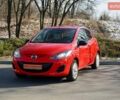 Красный Мазда 2, объемом двигателя 1.3 л и пробегом 130 тыс. км за 5400 $, фото 1 на Automoto.ua