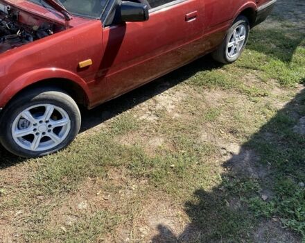 Красный Мазда 2, объемом двигателя 2 л и пробегом 310 тыс. км за 1119 $, фото 4 на Automoto.ua