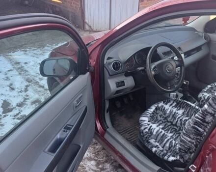 Красный Мазда 2, объемом двигателя 1.3 л и пробегом 164 тыс. км за 3500 $, фото 5 на Automoto.ua