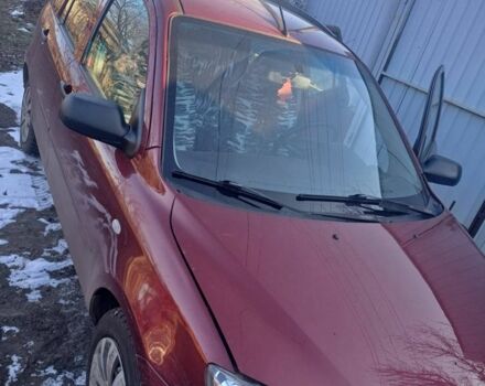 Красный Мазда 2, объемом двигателя 1.3 л и пробегом 164 тыс. км за 3500 $, фото 4 на Automoto.ua